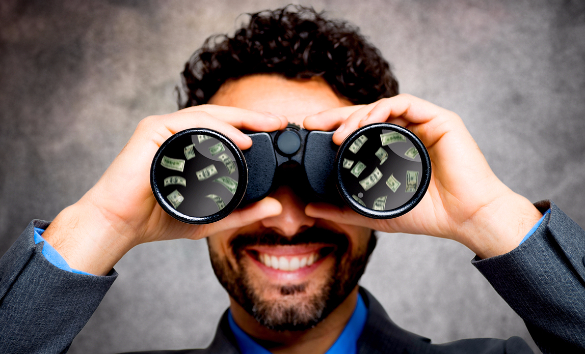 Man looking through binoculars at potential sales
